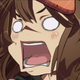 Guilty Gear Strive's May screams as she's hit by Faust's super attack.